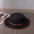 Detail of black straw boater hat with brown leather band and gold buckle accents - M (56-58cm) / Black