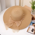 Detail of wide brim straw sun hat with organza bow and white pearl band decoration - M (56-58cm) / Khaki