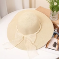 Close-up of woven straw sun hat with white pearl trim and organza ribbon bow detail - M (56-58cm) / Beige
