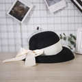 Detail of fine black straw weaving with a cream ribbon and large decorative bow - M (56-58cm) / Black