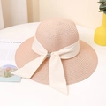 Detail of wide brim straw hat featuring a large satin bow and crystal buckle ornament - M / Nude Pink