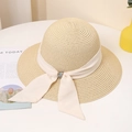 Close-up of wide-brimmed straw hat featuring ribbon tie and colorful gemstone buckle detail - M / Beige