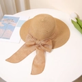 Close-up of khaki straw sun hat with large bow detail on a white table with tulips - M (56-58cm) / Khaki