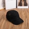 Close-up of black knitted baseball cap with breathable checkerboard weave on wooden desk - M (56-58cm) / Black