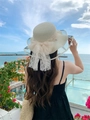Close-up of beige woven straw hat with large lace bow and pearl accents for summer - M (56-58cm) / Milk White