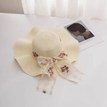 Women's wide brim straw sun hat with lace flower embroidery and ribbon bow for summer vacation - M (56-58cm) / Milk White