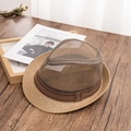 Detail view of two-tone mesh straw fedora hat on vintage dark wood tabletop - M (56-58cm) / Khaki