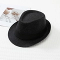 Top view of a dark grey wool fedora hat with black ribbon on white waffle texture - M / Dark Grey