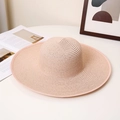 Close-up of the woven texture on a lotus pink wide-brim straw sun hat for women - M (56-58cm) / Nude Pink