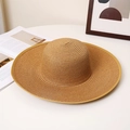Detailed view of dark brown wide-brim straw hat with reinforced trim and spiral weave texture - M (56-58cm) / Khaki