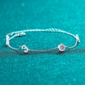 Elegante bracciale in argento S925 con moissanite e ciondoli numerici su sfondo glitter - Moissanite da 0,5 Carati / Argento 925