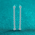 S925 sterling silver drop earrings featuring long moissanite tassels on blue background - Moissanite