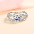 Elegant S925 sterling silver moissanite ring with a unique infinity twist band design - US 9