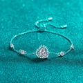Elegant S925 sterling silver heart bracelet with blue moissanite on a blue glitter background - 925 Silver / 1 Carat White Moissanite