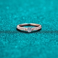 Champagne gold Moissanite ring with round center stone and diamond accents on a green background - US 8 / Champagne Gold