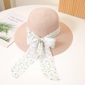 Detalle de sombrero de paja rosa con cinta floral y lazo grande para sol y la playa - M (56-58cm) / Rosa carne
