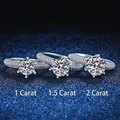 Three classic six-prong moissanite rings in 1, 1.5, and 2 carats on a dark blue background - US 9 / 6.5mm High Carbon Stone