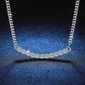 S925 sterling silver necklace with a curved sparkling diamond smile pendant on blue background - 925 Silver / 3.5mm 2.2ct Moissanite
