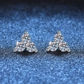 Three-stone S925 sterling silver clover moissanite stud earrings on a blue background - Moissanite Style