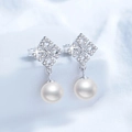 Elegante S925 zilveren pareloorbellen met sprankelende diamanten stud-details - 925 zilver / Moissaniet + 8mm Zoetwaterparel