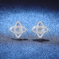 Sparkling S925 sterling silver lotus star stud earrings with moissanite on dark background - 925 Silver / High Carbon Stone