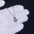 925 sterling silver heart necklace with 1 carat moissanite pendant shown on a hand - 8mm High Carbon Stone / 925 Silver