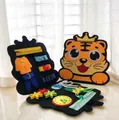 Foldable orange tiger felt busy board for kids featuring zippers buckles and gears - Tiger Style 15