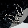 Minimalist S925 sterling silver irregular wavy long earrings on a dark reflective surface - 925 Silver / White Gold