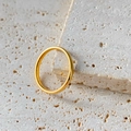 Minimalist 2mm wide polished gold stainless steel thin ring for women shown on stone - US7 / 18K Gold