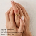 Close-up of 3mm minimalist 14K gold and silver stainless steel rings on a hand model - 3mm / US 5 / Gold