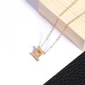 Gold plated stainless steel Gemini zodiac pendant necklace with polished mirror finish - Steel / Gemini