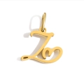Close-up of golden letter Z pendant with heart detail in high-polish stainless steel - Steel / Letter Z