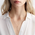 Close-up of minimalist gold vertical bar necklace worn on a white shirt - Chain 42+8CM / 30*2MM Bar Gold Color (YX15474)