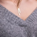 Gold minimalist bar pendant necklace shown on a model with a grey knitted sweater - Chain 42+8CM / Double Bar Gold Color (YX30636)