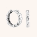 Elegant S925 sterling silver hoop earrings featuring pear-cut zircon stones on beige background - 925 Silver / White Gold