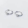 S925 sterling silver Mobius hoop earrings with sparkling cubic zirconia on white background - 925 Silver / White Gold