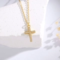 Elegant gold cross pendant necklace with sparkling micro-set cubic zirconia on white stone - 925 Silver / Gold