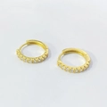 Detailed close-up of gold-plated hoop earrings with pave-set cubic zirconia stones - 925 Silver / Gold