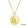 Macro shot of Scorpio zodiac pendant in gold finish with delicate cross chain - Scorpio / 925 Silver