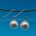 Minimalist S925 sterling silver white pearl drop earrings on a bright blue background - 925 Silver / White