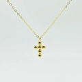 Detailansicht einer minimalistischen Kreuzkette aus 925er Silber mit goldenen Perlen - 925er Silber / Gold
