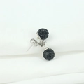 Macro shot of 925 silver stud earrings featuring black pave crystal disco balls - 6mm (With Plastic Plug) / Black Rhinestone