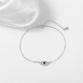 Elegante bracciale in argento sterling 925 con zircone blu e sfondo di seta bianca - Argento 925 / Oro Bianco