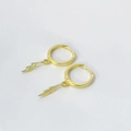 Close-up of gold lightning bolt charm huggie earrings made of S925 sterling silver - 925 Silver / Gold