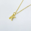 Macro detail of gold-plated K letter pendant necklace with micro-pave cubic zirconia crystals - Letter K / 925 Silver Gold Plated