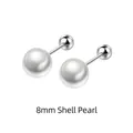 Macro view of 8mm round white shell pearls with S925 silver screw back closure - 925 Silver / 8mm