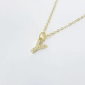 Macro shot of gold S925 silver Y-letter pendant necklace with shimmering cubic zirconia - Letter Y / 925 Silver Gold Plated
