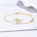 Bracciale a cavallo a dondolo dorato con zirconia scintillante su sfondo bianco pulito - Argento 925 / Oro (Stile 1)