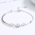 Bracciale rigido minimalista in argento sterling S925 con accenti geometrici e cuore - Argento 925 / Oro Bianco