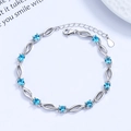 Elegant S925 sterling silver bracelet with ten blue round crystals and wavy links - 925 Silver / Blue Zirconia - Platinum Color